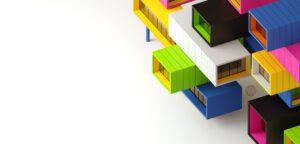 Brightly coloured modular boxes with windows stacked haphazardly.