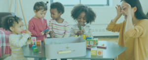 A woman playing with toddlers